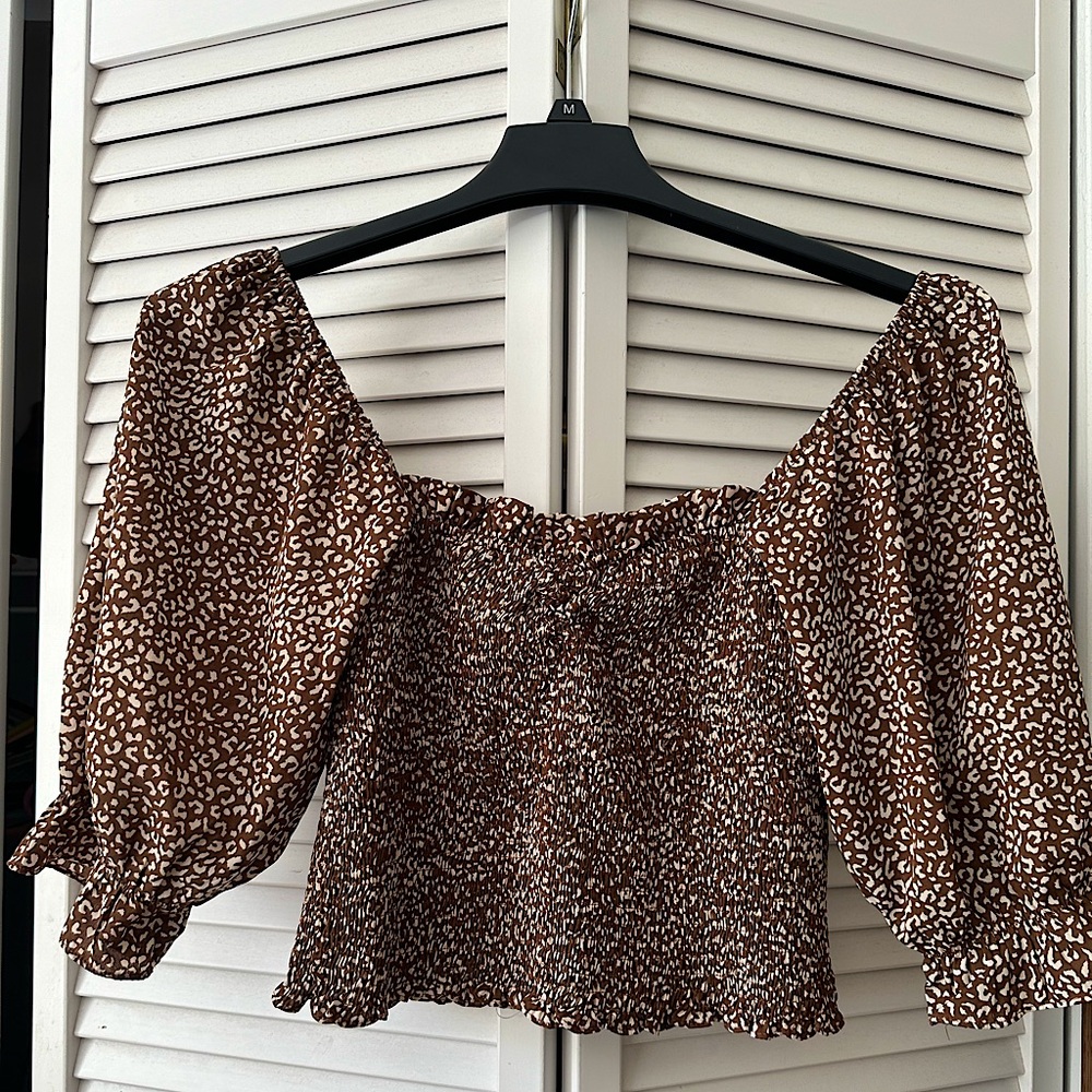 Kittenish cropped off shoulder top